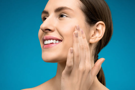 Woman touching her cheek and smiling