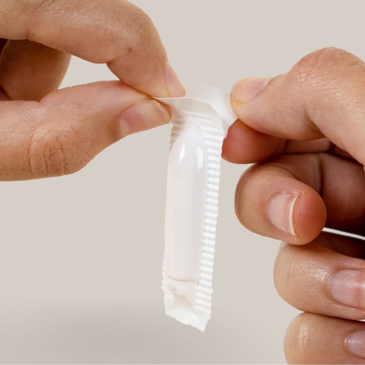 Man opening ozone suppository package how to
