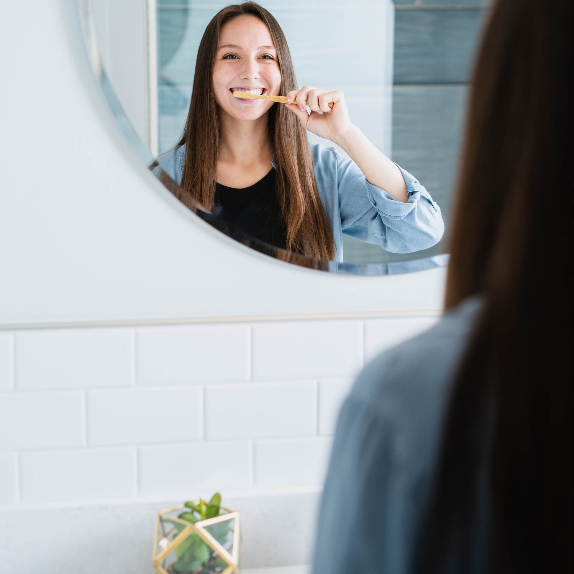 beautiful girl brushing teeth with ozone toothpaste