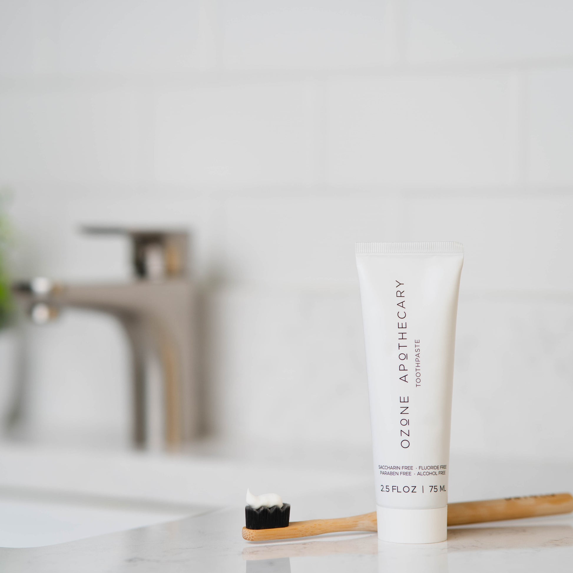 ozone toothpaste on counter with toothbrush