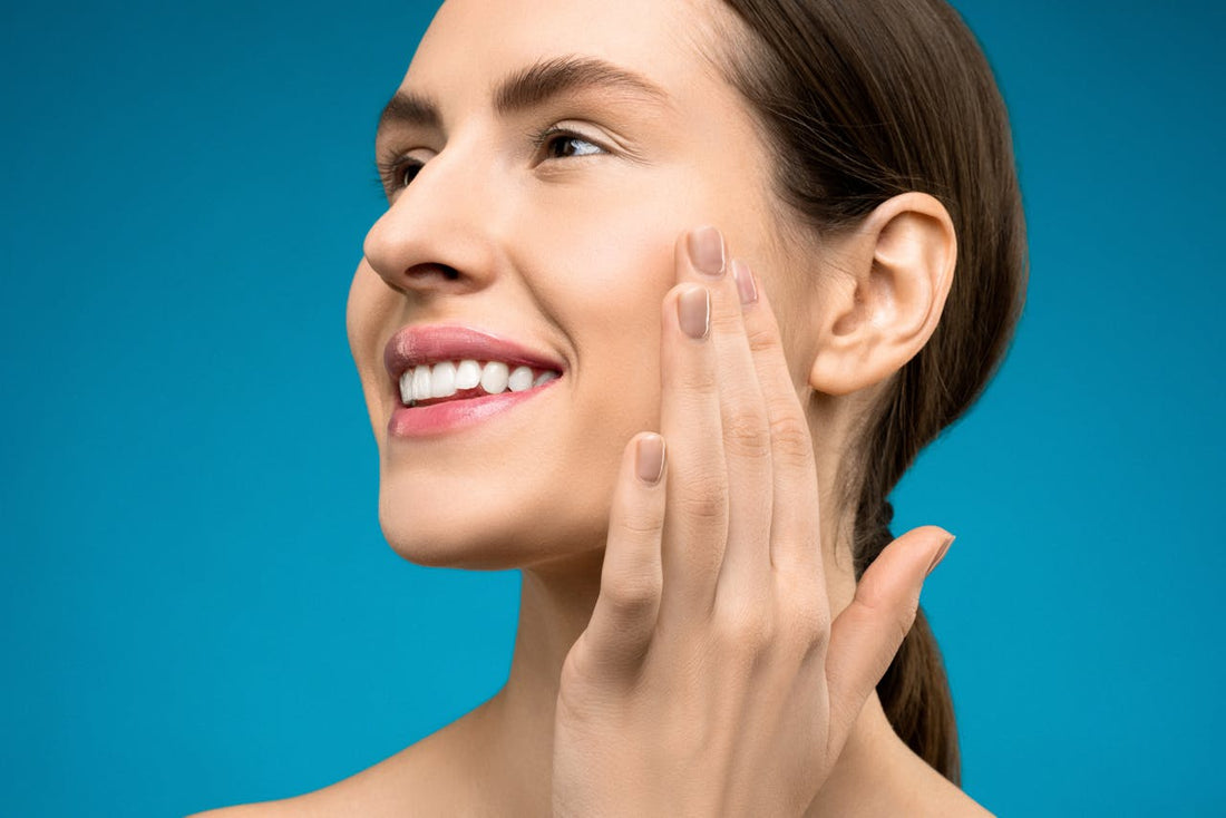 Woman touching her cheek and smiling